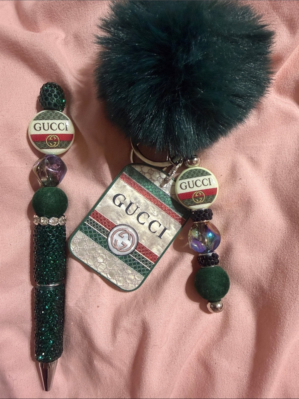 Green matching keychain and rhinestone pen with extra pen refill.